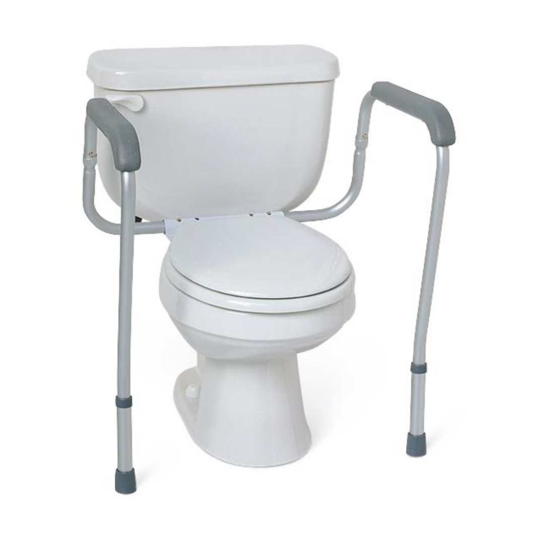The Medline Aluminum Foldable Toilet Safety Rail is a white unit with gray adjustable rails on both sides for customizable support, universally compatible with most commodes, and designed to aid those with mobility challenges.